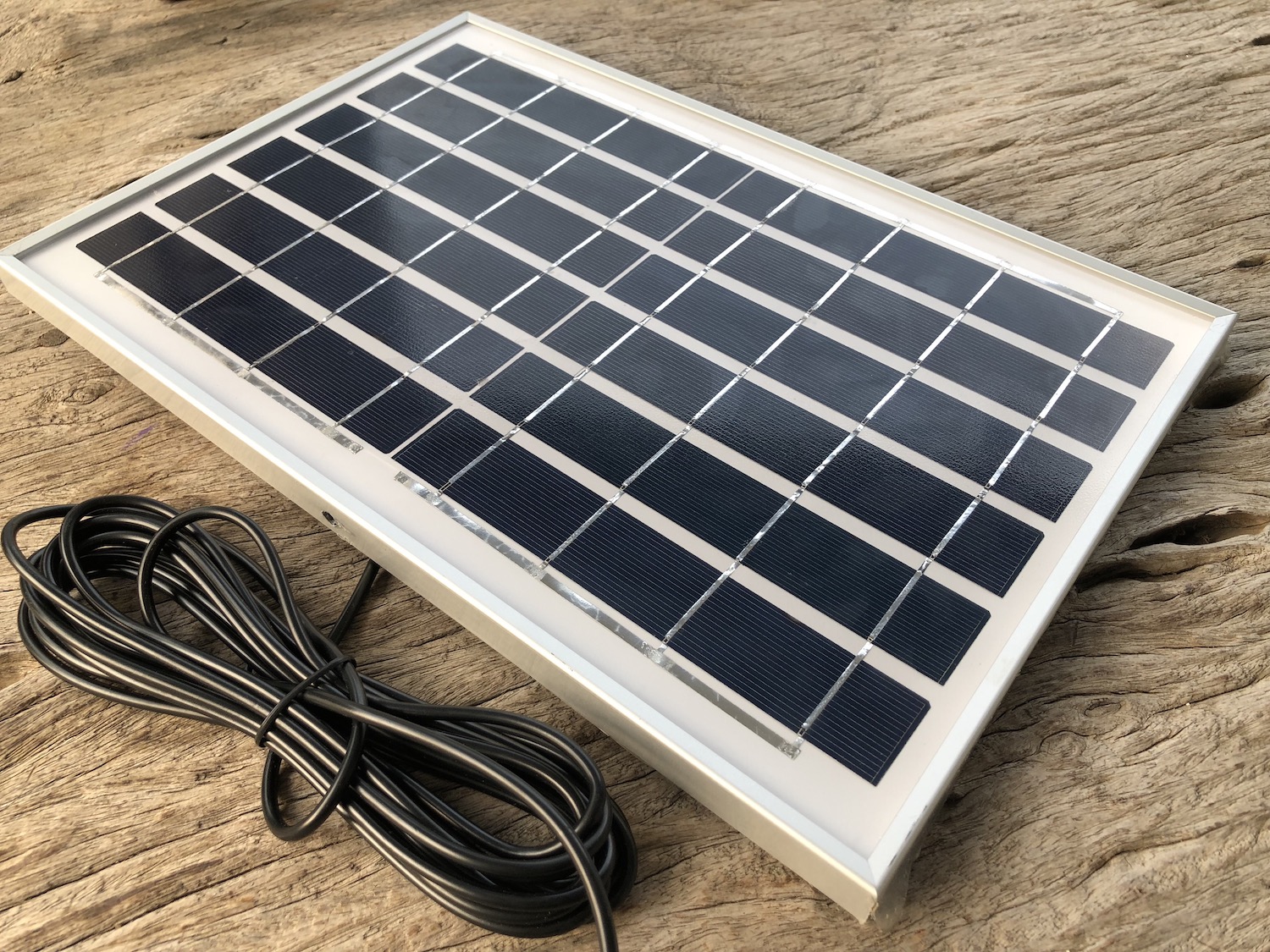 solar-panel-closeup-on-wooden-table-background-2022-11-04-00-56-12-utc
